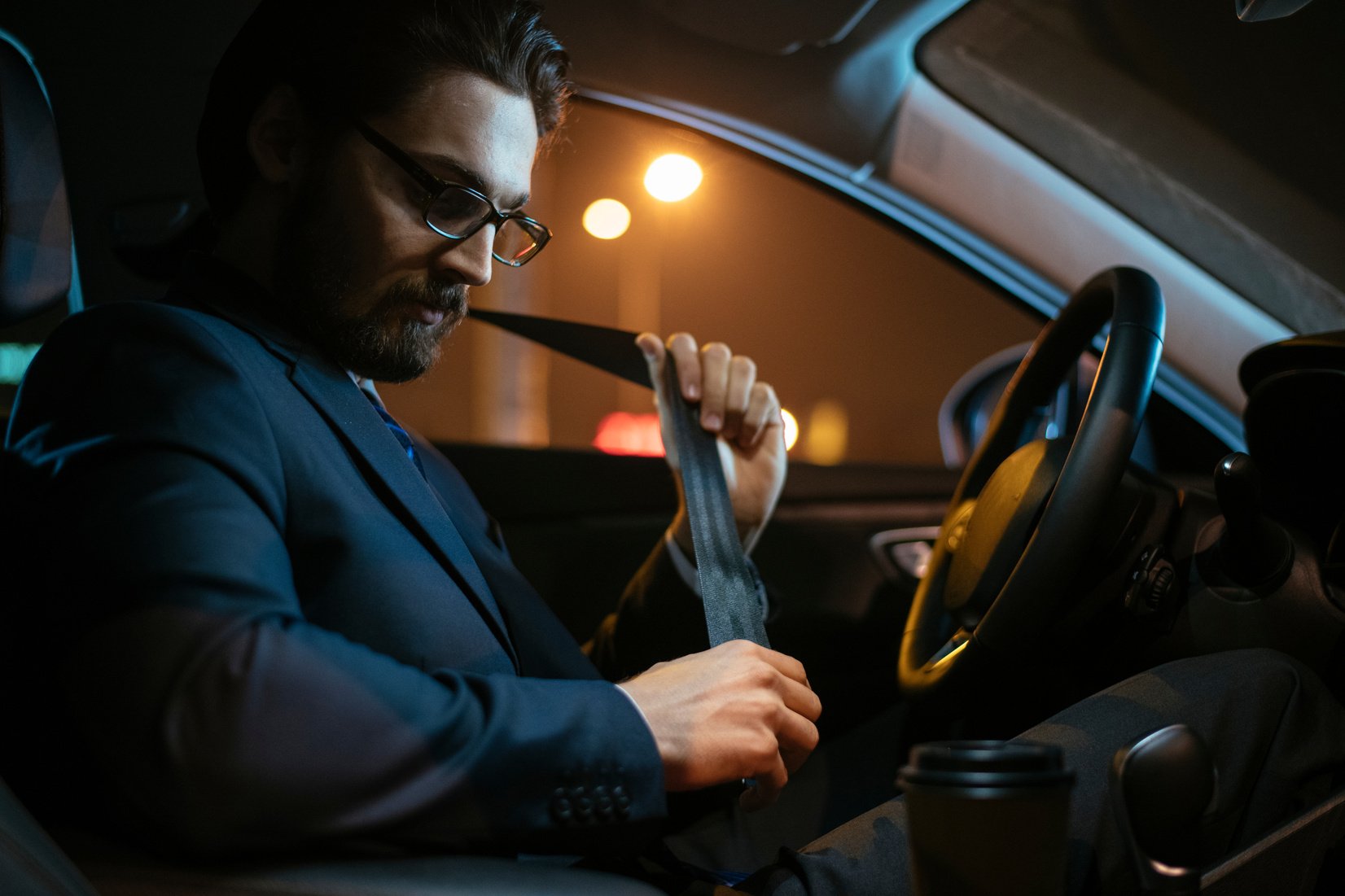 Driver tying seatbelt